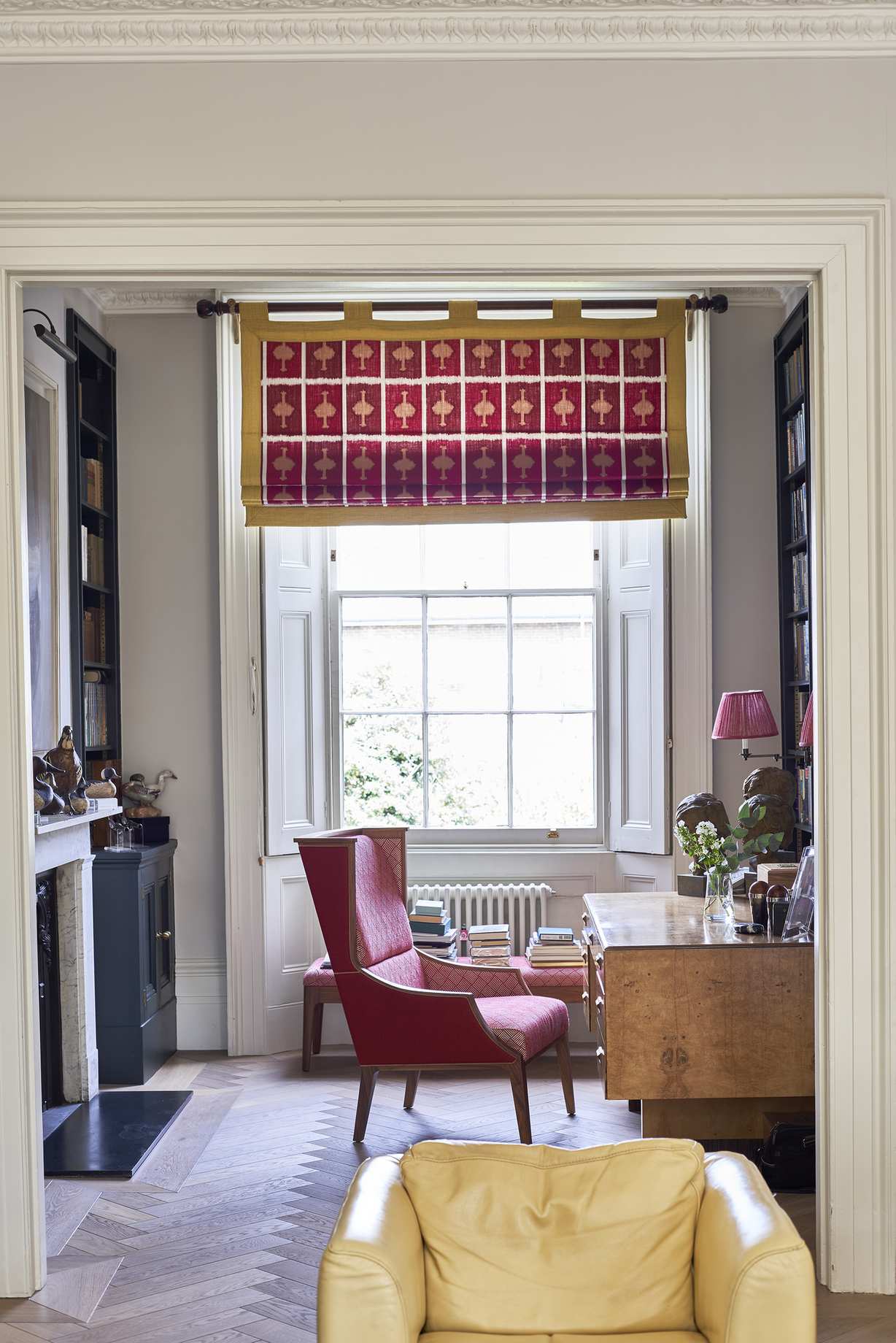 Blinds in Ozone in Ruby bordered with Alto in Lemon, both Christopher Farr Cloth
