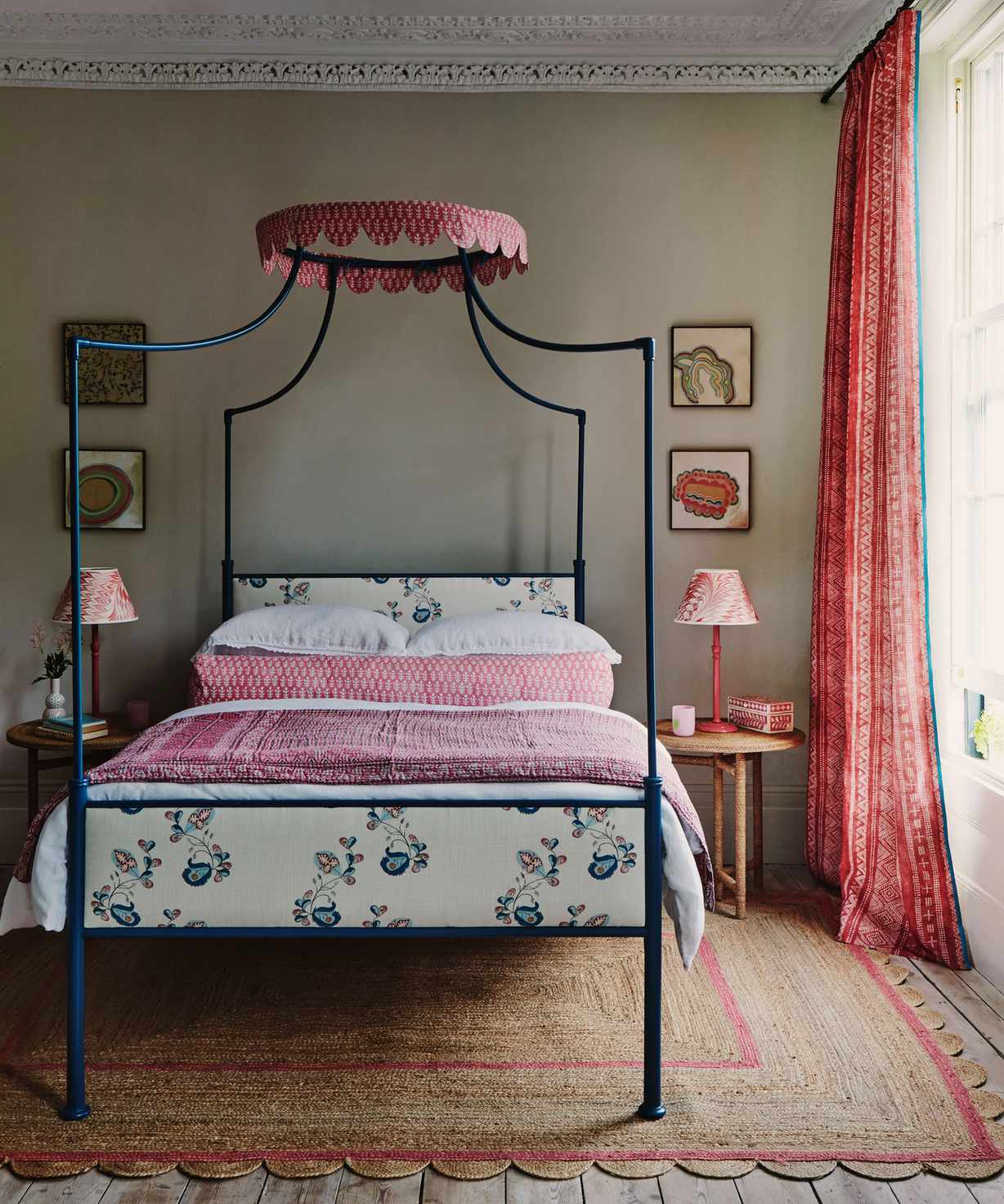 A pretty bedroom scheme with blue painted four poster bed and pretty pink textiles